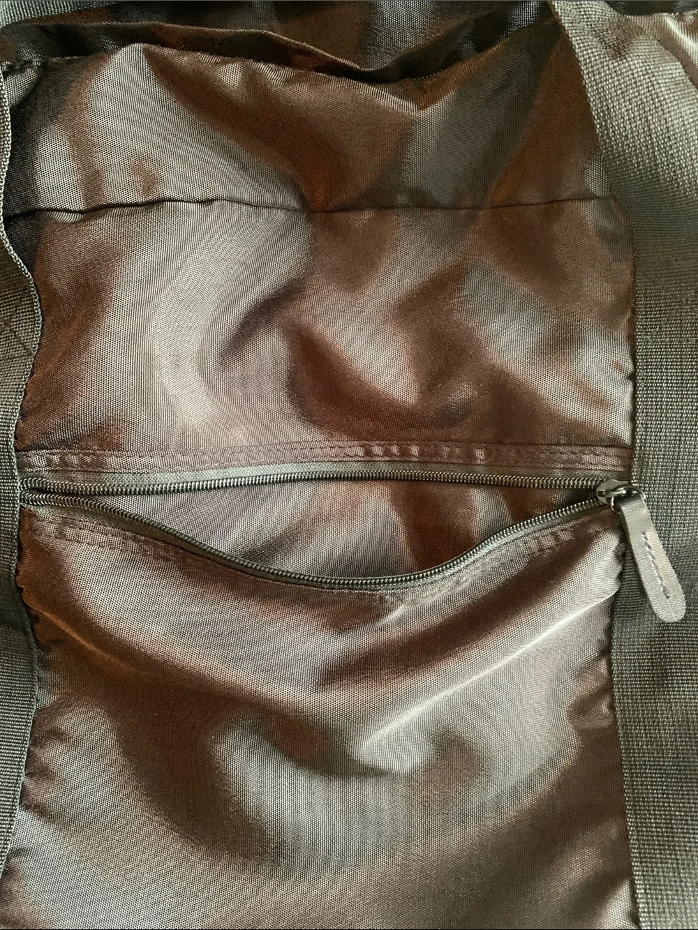 EUC black nylon duffel bag with strap. Approximately 22” x 14” x 10.5”